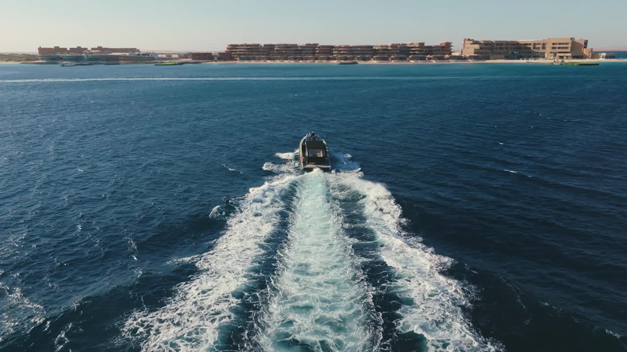 Approaching Sindalah by boat — destination context